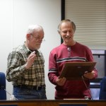 Kenai Peninsula Borough Assembly member Bill Smith of Homer accepts a plaque from member Brent Johnson during Smith’s last meeting on Tuesday in Soldotna.-Photo by Rashah McChesney/Peninsula Clarion