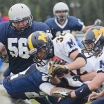 Homer High School running back Josh Fisk gets taken down during the game against Soldotna High School Sept. 21 in Soldotna.-Photo by Rashah McChesney, Morris News Service - Alaska