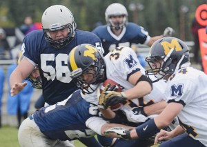 Homer High School running back Josh Fisk gets taken down during the game against Soldotna High School Sept. 21 in Soldotna.-Photo by Rashah McChesney, Morris News Service - Alaska
