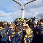 With the seniors in the center, the Mariner football team gathers around the goal post after Saturday’s homecoming game against the Lathrop Malemutes.-Photo by McKibben Jackinsky,  Homer News