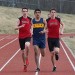 Homer’s Pedro Ochoa, center, is a close third to Kenai runners Jonah and Jordan Theisen in the boys 1600 meter event.-Photo by McKibben Jackinsky, Homer News