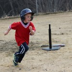 Josh Rudolph makes a dash for first base.-Photo by McKibben Jackinsky, Homer News