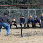 Facing the Paul Banks baseball team, coaches Kate Crowley and Don Felton lead warmups. The team, from left: Einar Pedersen, Josh Rudolph, Carter Collins, Sydney Shelby, Cutter Shelby, Nathaniel Theisen, Henry Wedvik and Paige Haines.-Photo by McKibben Jackinsky, Homer News