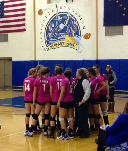 Coach Beth Trowbridge preps the Homer volleyball team with some encouraging words before its first match against Skyview on Tuesday.-Photo by Shannon Reid