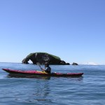 A kayaker passes by Elephant Rock near Yukon Island, one of the sites along the Kachemak Bay Water Trail.-Photo provided, True North Kayak Adventures