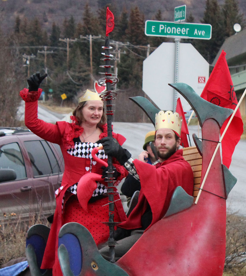 The Queen and King of Hearts, Catriona and Derek Reynolds, greet their subjects during Saturday’s parade.-Photo by McKibben Jackinsky, Homer News