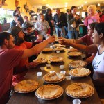 Rocky Berg, Troy Parsons, Kaleb Long, Meghan Kerlin and Sadie Millard toast with a taste of Piehole Whiskey at the start of the Sunday pie-eating contest at Down East Saloon.-Photo by McKibben Jackinsky, Homer News