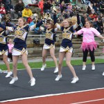 Homer High School cheerleaders pump up the crowd at Saturday’s homecoming football game against Voznesenka. The Mariners won the game 55-0.-Annie Rosenthal, Homer News