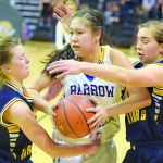 Homer sophomore Alissa Cole and senior Aurora Waclawski trap Barrow’s Kuutuuq Danner in Saturday’s Class 3A state championship final.-Photo by Joey Klecka, Morris News Service - Alaska