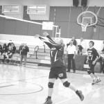 Nikolaevsk senior Feodora Mametieff prepares for a volley with support from Seniors Greg Trail and Jonah Fefelov.-Photo by Nicetas Lasiter