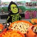 Skeleton Thomas Wetherill tries to choose between such delicacies as spiders’ eggs and witches’ nails.-Photo by McKibben Jackinsky, Homer News