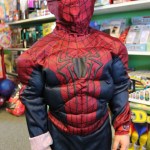 Spiderman Kameron Rogers checks out the toys at Timeless Toys on Saturday before participating in the store’s Halloween party.-Photo by McKibben Jackinsky, Homer News