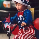 Bradley Bordner rides his tricycle in the 2003 Homer Fourth of July parade.-Homer News archive photo
