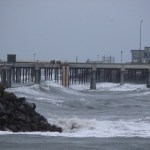 High waves splash against rocks at the entrance to the Homer Harbor.-Photo by McKibben Jackinsky, Homer News