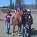 Angela Beplat, second from right, and horse Sally offer a mock horse therapy lesson to Robin Wiese, left, Jazzy Frankhouser, center, and Riana Boonstra, right.-Photo by Jeannie Fabbich
