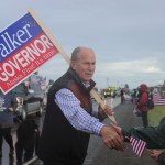 Bill Walker, gubernatorial candidate, greets spectators at the Kenai Peninsula Fair parade Saturday morning in Ninilchik.-Photo by McKibben Jackinsky; Homer News