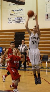 Mariner Jeremy Tedesco shoots over a Houston opponent.-Photo by Lindsay Olsen