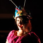 Brianna Allen models “Fuschia Pushki Dress” by Mahan Woods and “R,” hat, by Michael Armstrong.-Photo by Michael Armstrong, Homer News