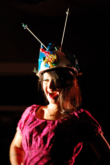 Brianna Allen models “Fuschia Pushki Dress” by Mahan Woods and “R,” hat, by Michael Armstrong.-Photo by Michael Armstrong, Homer News