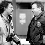 Jim Lavrakas talks with Anchorage Police Department Lt. Bill Casto about access to a crime scene after being barred by another officer in April 1989.-Photo by Paul Souders, Anchorage Daily News