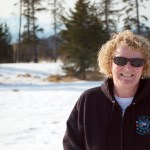 Dana Stabenow stands on the future site of Storyknife, the writers retreat she and her foundation plan to build. The retreat is on the bluff north of Homer near Diamond Creek. A sketch, below, shows one of the cabins.-Photo Provided