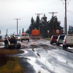 Traffic moves around a mudslide on East End Road and Bear Creek Drive on Monday before road crews closed it to clean up debris.-Photo by Michael Armstrong, Homer News