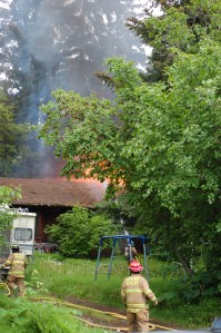 Homer Volunteer Fire Department and Kachemak Emergency Services firefighters respond to a house fire on Rainbow Court on Friday morning. Firefighters discovered a person had died in the fire.