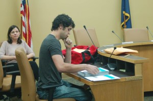 As three Homer Police officers stood by observing, the recount of the Homer City Council began with fourth-place Homer City Council candidate Justin Arnold laboriously examining and hand counting ballots. In the photo above, Arnold looks at the ballots as deputy clerk Melissa Jacobsen watches.