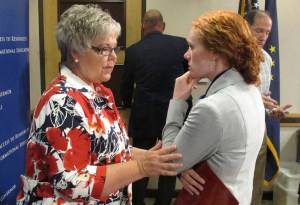 Kenai Mayor Pat Porter, left, speaks to Alaska Department of Fish and Game Commissioner Cora Campbell following a news conference on July 20, 2012, in Anchorage. Porter attended a news conference led by Campbell and Alaska Gov. Sean Parnell to address actions the state can take in light of the poor king salmon run statewide, affecting both subsistence, sport and commercial fishermen. During the 2013 legislative session, Parnell successfully lobbied for $30 million over five years to research king salmon and possible causes for the decline in productivity seen statewide.-Photo by Mark Thiessen, Associated Press