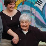 Jennifer Norton, left, holds Mary Epperson’s hand as she visits her Etude Studio.-Photo by Michael Armstrong, Homer News