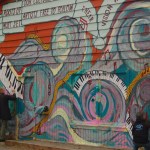 Visitors write on the studio wall during Mary Epperson Day last Friday.-Photo by Michael Armstrong, Homer News