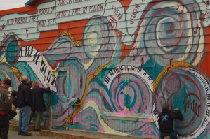 Visitors write on the studio wall during Mary Epperson Day last Friday.-Photo by Michael Armstrong, Homer News