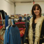 Lawmaster models a coat and stands before other selections. -Photos by Michael Armstrong, Homer News