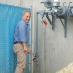 At left, Gov. Sean Parnell turns the valve at the natural gas valve-turning ceremony July 25 at South Peninsula Hospital. Gas has not yet been hooked up to the hospital, but it is the first Homer public facility plumbed and ready to receive natural gas when it starts flowing later this summer.-Photo by Michael Armstrong, Homer News