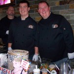 Boss Hoggz crew Rich Jamieson, Garet Moyer and restaurant owner Jimmy Lower, serve sundaes at the Saturday night event.-Photo by McKibben Jackinsky, Homer News