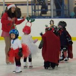 Coach McKinzie Parker directs skaters Yumin Yi and Joy Ridgely during Sunday’s figure-skating exhibition.-Photo by McKibben Jackinsky, Homer News