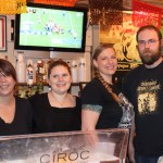 Keeping patrons happy before Alice’s Champagne Palace closed its doors on Sunday were servers Laura Duncan, Jill Gunnison and Nickie Knight, and bartender Dan Norton­.-Photo by McKibben Jackinsky, Homer News