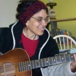 Lindianne Sarno entertains visitors during a break from moving into her new offices, Lindianne’s Music Garden, on West Pioneer Avenue.-Photo by McKibben Jackinsky, Homer News