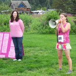 After Heather O'Conner, executive director of Kachemak Bay Family Planning Clinic, welcomed athletes to Sunday's Breast Cancer Run, KBFPC's Catriona Lowe gives runners and walkers last-minute instructions. -Photo by McKibben Jackinsky,  Homer News