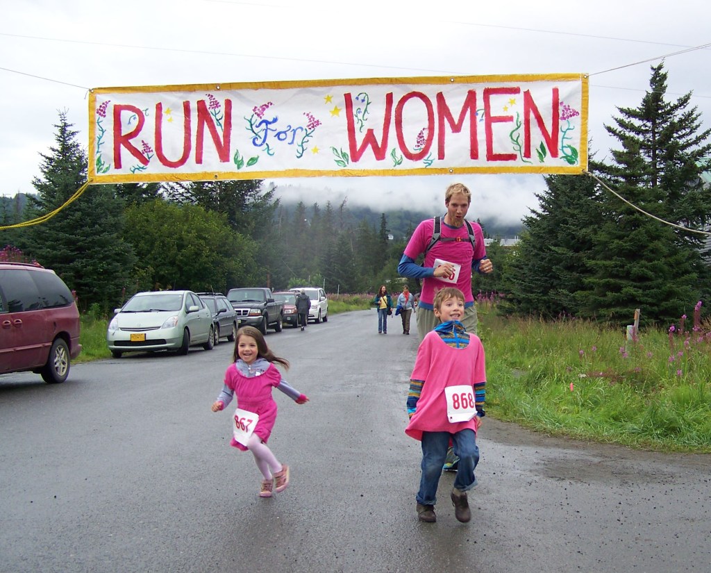 First walkers to cross the finish line: Derek Bynagle with daughter Etta and son Johannes-Photo by McKibben Jackinsky,  Homer News