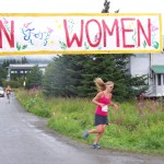 Mary Kate Green is the first woman across the finish line of Sunday's Breast Cancer Run, with a time of 37:41:00. She was followed closely by Hanna Johnson, with a time of 37:48:00.-Photo by McKibben Jackinsky,  Homer News