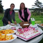 Megan Palma of Kachemak Bay Family Planning Clinic and Bobbi Unger of Breast and Cervical Health Check prepare refreshments for athletes at the end of Sunday's Breast Cancer Run.-Photo by McKibben Jackinsky,  Homer News