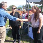 Gov. Sean Parnell, left, greets Homer Mayor Beth Wythe, right, as Katie Koester looks on.-Photo by McKibben Jackinsky, Homer News