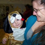 Puppy Jack Roderick, 5 months, cuddles with his mom, Stacey, at Chapman School's Halloween festivities last Friday. -Photo by McKibben Jackinsky, Homer News