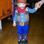 18-month-old Micheal Merritt might be too young to attend Chapman Elementary School, but he's definitely not short on cowboy spirit at the school's Halloween carnival last Friday.-Photo by McKibben Jackinsky, Homer News