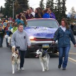 The Homer Middle School Huskies’ homecoming float was led by Principal Kari Dendurent, right, with Demon, and Jaime Sylva, left, with Lucien.-Photo by McKibben Jackinsky, Homer News