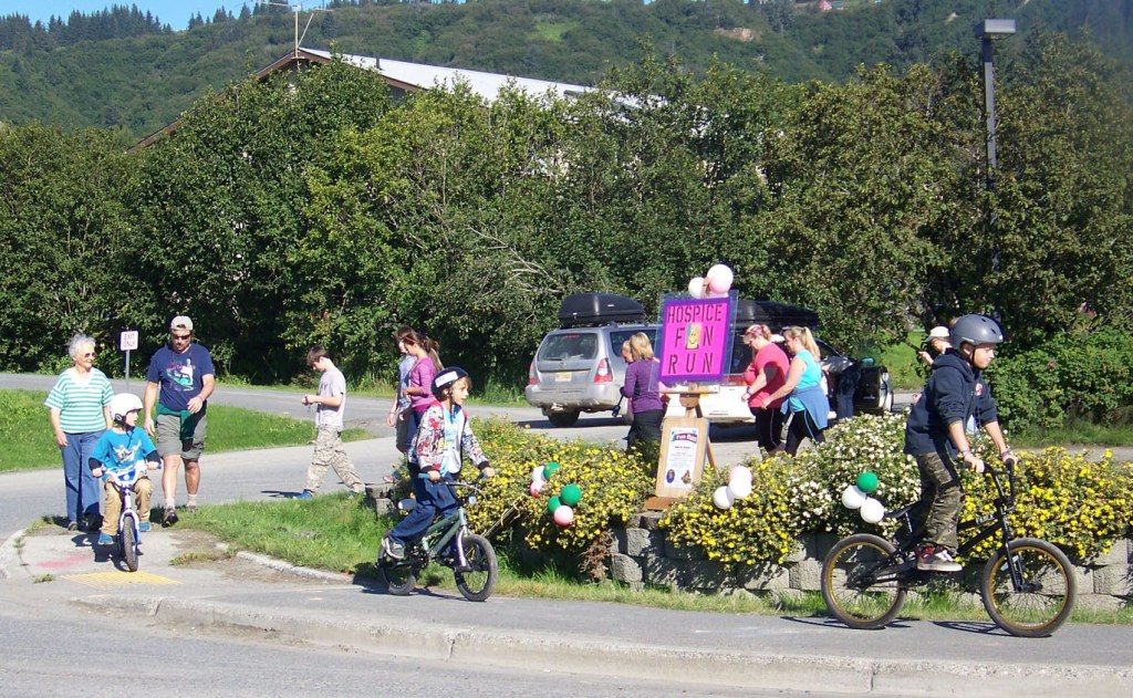 Cyclists, runners, walkers, babies in strollers and man’s best friend launch into Soles for Hospice, a 5K fun run and held Saturday. The event began at the Hospice of Homer offices and ended with a reception at Bear Creek Winery.-Photo by McKibben Jackinsky, Homer News