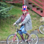 Ian McGaughey drives Seldovia Chamber of Commerce’s four-wheeler in that community’s parade-Photo by McKibben Jackinsky, Homer News