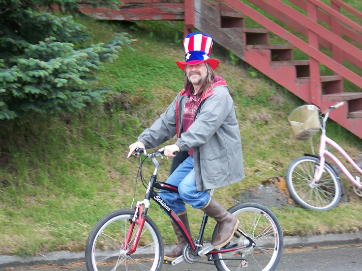 Ian McGaughey drives Seldovia Chamber of Commerce’s four-wheeler in that community’s parade-Photo by McKibben Jackinsky, Homer News