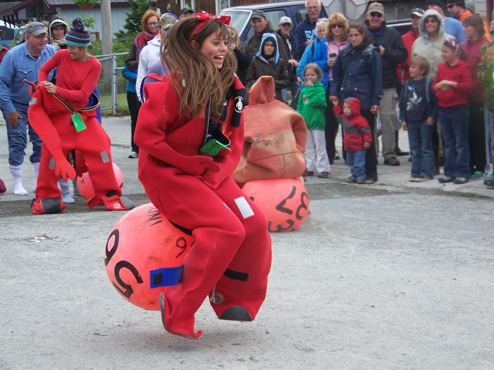 Susan Mumma of Seldovia and Gail Claus of Homer give a ukulele serenade along Seldovia’s main street. -Photo by McKibben Jackinsky, Homer News